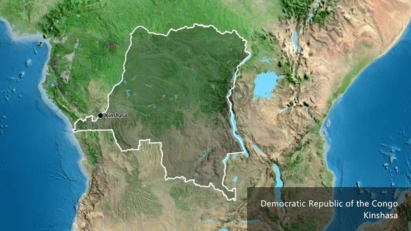 stock image Close-up of the Democratic Republic of the Congo border area highlighting with a dark overlay on a satellite map. Capital point. Outline around the country shape. English name of the country and its capital