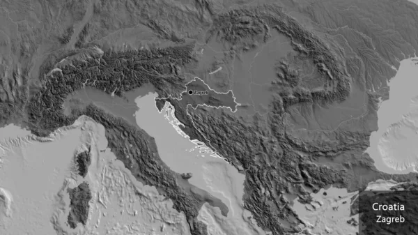 克罗地亚边境地区的特写镜头突出显示了一张双层地图上的黑暗阴影 资本点 概略地描述一下国家的面貌 国家及其首都的英文名称 — 图库照片
