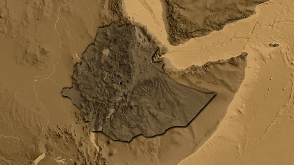 エチオピア国境地域のクローズアップは セピアの標高地図上の暗いオーバーレイで強調しています 資本ポイント 国の形の縁が隠されている — ストック写真