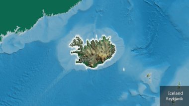 İzlanda sınır bölgesinin yakın çekimleri fiziksel bir harita üzerinde koyu bir örtüyle vurgulanıyor. Ana nokta. Ülke çapında parıldıyor. Ülkenin ve başkentinin İngilizce adı