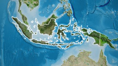 Endonezya sınır bölgesinin yakın planında uydu haritasında koyu bir örtüyle vurgulanıyor. Ana nokta. Ülke çapında parıltı. 