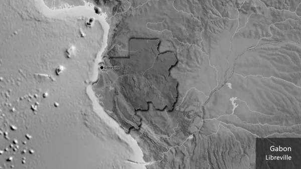 Gabon境界領域のクローズアップは グレースケールマップ上の暗いオーバーレイで強調表示されます 資本ポイント 国の形の縁が隠されています 英名国とその首都 — ストック写真
