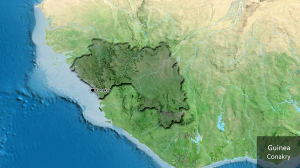 几内亚边境地区的特写镜头 用卫星地图上的黑暗阴影突出显示出来 资本点 这个国家的边缘呈斜角状 国家及其首都的英文名称 — 图库照片