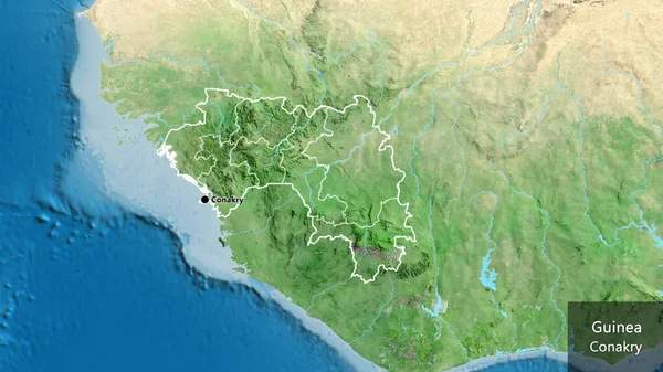 在卫星地图上对几内亚边境地区及其区域边界进行了密切监视 资本点 概略地描述一下国家的面貌 国家及其首都的英文名称 — 图库照片