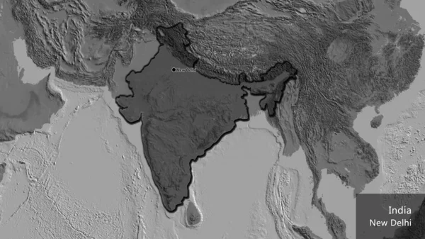 Close-up of the India border area highlighting with a dark overlay on a bilevel map. Capital point. Bevelled edges of the country shape. English name of the country and its capital