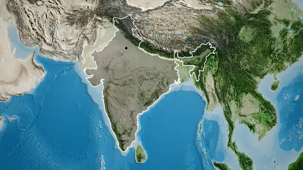 Close-up of the India border area highlighting with a dark overlay on a satellite map. Capital point. Outline around the country shape.