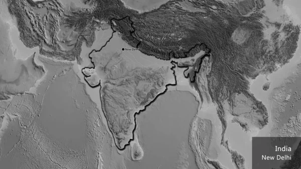 Close-up of the India border area on a grayscale map. Capital point. Bevelled edges of the country shape. English name of the country and its capital