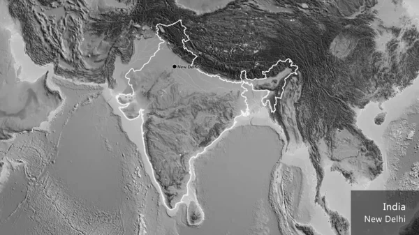 Close-up of the India border area on a grayscale map. Capital point. Outline around the country shape. English name of the country and its capital