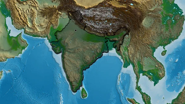 Close-up of the India border area highlighting with a dark overlay on a physical map. Capital point. Bevelled edges of the country shape.