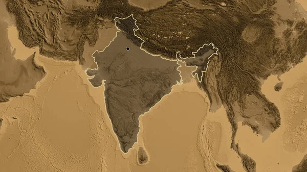 Close-up of the India border area highlighting with a dark overlay on a sepia elevation map. Capital point. Outline around the country shape.