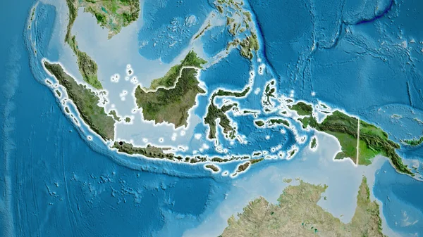 衛星地図上の暗いオーバーレイで強調されているインドネシア国境地域のクローズアップ 資本ポイント 全国に光る — ストック写真