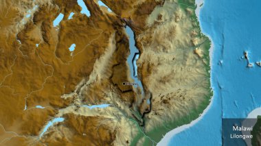 Malawi sınır bölgesinin yakın çekimleri bir yardım haritasında koyu bir örtüyle vurgulanıyor. Ana nokta. Kırsal kesimin kıvrımlı kenarları. Ülkenin ve başkentinin İngilizce adı