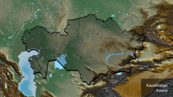 カザフスタン国境地域のクローズアップは 救援地図上の暗いオーバーレイで強調しています 資本ポイント 国の形の縁が隠されています 英名国とその首都 — ストック写真