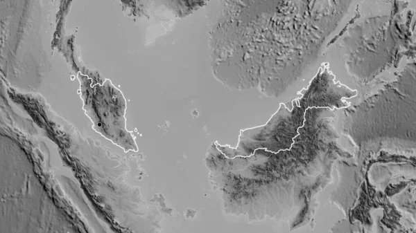 在一张灰色比例尺地图上对马来西亚边境地区进行的密切监视 资本点 国家形貌概述 — 图库照片