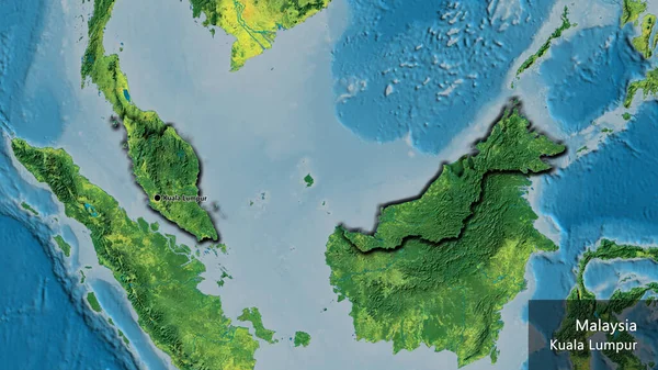 stock image Close-up of the Malaysia border area on a topographic map. Capital point. Bevelled edges of the country shape. English name of the country and its capital