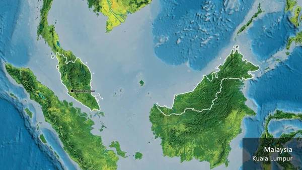 stock image Close-up of the Malaysia border area on a topographic map. Capital point. Outline around the country shape. English name of the country and its capital