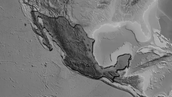 Close-up of the Mexico border area highlighting with a dark overlay on a grayscale map. Capital point. Bevelled edges of the country shape.