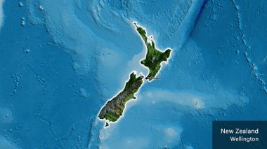 Yeni Zelanda sınır bölgesinin, uydu haritasında koyu bir örtüyle ışıklandırılması. Ana nokta. Ülke çapında parıldıyor. Ülkenin ve başkentinin İngilizce adı