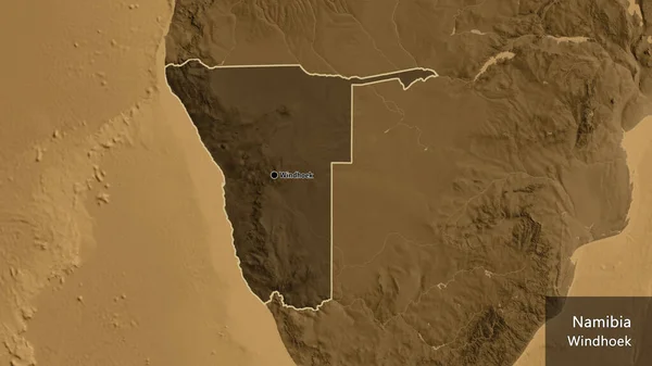 纳米比亚边境地区的特写镜头突出显示了黑色的覆盖在黑色的高程地图上 资本点 概略地描述一下国家的面貌 国家及其首都的英文名称 — 图库照片
