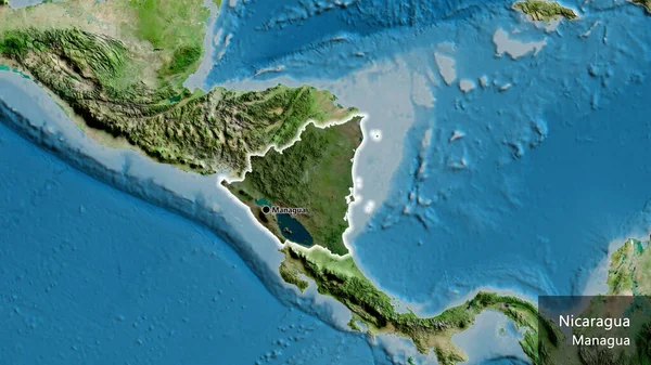 衛星地図上の暗いオーバーレイで強調しているニカラグア国境地域のクローズアップ 資本ポイント 国の形の周りに光る 英名国とその首都 — ストック写真