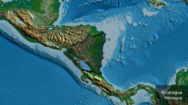 ニカラグアの国境地帯のクローズアップは 物理的な地図上の暗いオーバーレイで強調されています 資本ポイント 国の形の縁が隠されています 英名国とその首都 — ストック写真