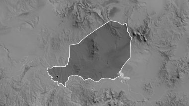 Nijer sınır bölgesinin, gri tonlu bir harita üzerinde koyu bir örtüyle ışıklandırılması. Ana nokta. Ülke şekli etrafında özet geç. 