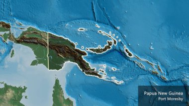 Papua Yeni Gine sınır bölgesinin yakın planında, bir kabartma haritasında koyu bir örtüyle vurgulanıyor. Ana nokta. Ülke çapında parıldıyor. Ülkenin ve başkentinin İngilizce adı