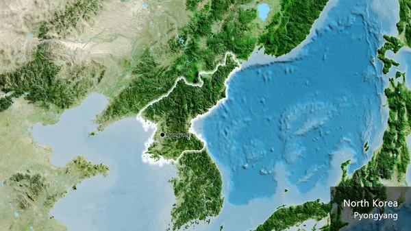 Close-up of the North Korea border area on a satellite map. Capital point. Glow around the country shape. English name of the country and its capital