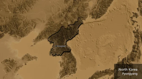 北朝鮮国境地域のクローズアップは セピアの標高地図上の暗いオーバーレイで強調しています 資本ポイント 国の形の縁が隠されています 英名国とその首都 — ストック写真