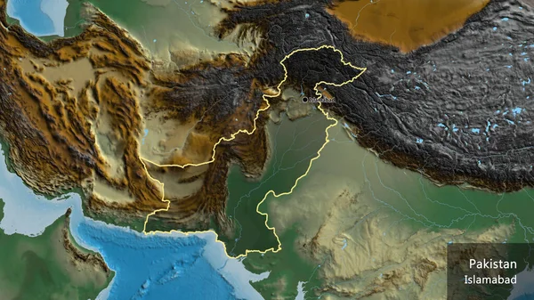 Stock image Close-up of the Pakistan border area highlighting with a dark overlay on a relief map. Capital point. Outline around the country shape. English name of the country and its capital