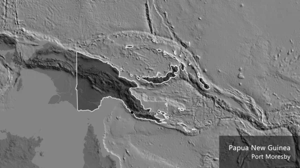 Papua Yeni Gine sınır bölgesinin yakın planında bilek haritasında koyu bir örtüyle işaretlenmiş. Ana nokta. Ülke çapında bir taslak oluşturun. Ülkenin ve başkentinin İngilizce adı