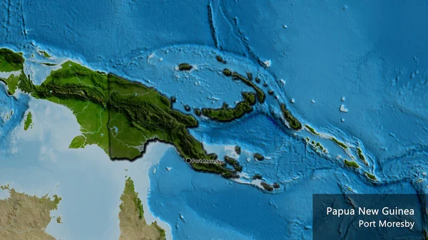 巴布亚新几内亚边境地区的特写镜头 以卫星地图上的黑暗覆盖为重点 资本点 这个国家的边缘呈斜角状 国家及其首都的英文名称 — 图库照片