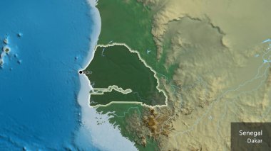 Senegal sınır bölgesinin yakın plan çekimleri bir yardım haritasında koyu bir örtüyle vurgulanıyor. Ana nokta. Ülke çapında parıldıyor. Ülkenin ve başkentinin İngilizce adı