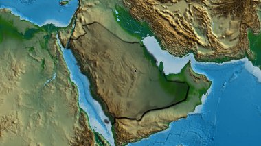 Suudi Arabistan sınır bölgesinin yakın çekimleri fiziksel bir harita üzerinde koyu bir örtüyle vurgulanıyor. Ana nokta. Ülkenin kıvrımlı kenarları. 