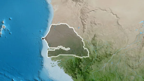 Stock image Close-up of the Senegal border area highlighting with a dark overlay on a satellite map. Capital point. Glow around the country shape. 