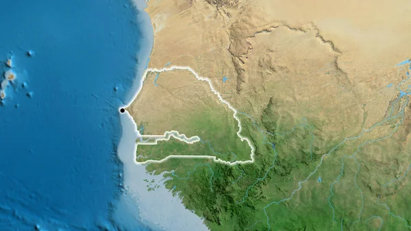 stock image Close-up of the Senegal border area on a satellite map. Capital point. Glow around the country shape. 