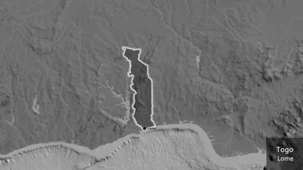 レベルマップ上の暗いオーバーレイで強調表示されるトーゴ境界領域のクローズアップ 資本ポイント 国の形の周りに光る 英名国とその首都 — ストック写真