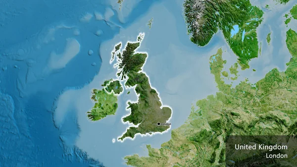 stock image Close-up of the United Kingdom border area highlighting with a dark overlay on a satellite map. Capital point. Glow around the country shape. English name of the country and its capital