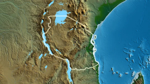 stock image Close-up of the Tanzania border area on a physical map. Capital point. Glow around the country shape. 