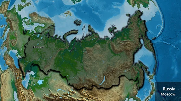 物理的な地図上の暗いオーバーレイで強調されているロシア国境地域のクローズアップ 資本ポイント 国の形の縁が隠されています 英名国とその首都 — ストック写真