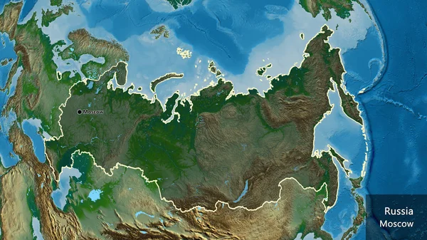 物理的な地図上の暗いオーバーレイで強調されているロシア国境地域のクローズアップ 資本ポイント 国の形の周りの概要 英名国とその首都 — ストック写真