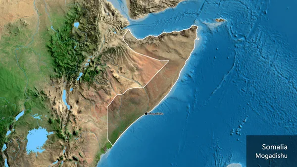 衛星地図上の暗いオーバーレイで強調ソマリア国境地域のクローズアップ 資本ポイント 国の形の周りの概要 英名国とその首都 — ストック写真