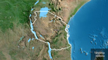 Tanzanya sınır bölgesinin uydu haritasında yakın plan görüntüsü. Ana nokta. Ülke çapında parıldıyor. Ülkenin ve başkentinin İngilizce adı