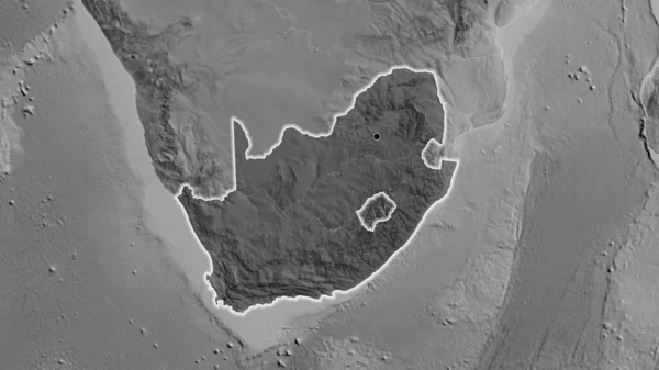 Close-up of the South Africa border area highlighting with a dark overlay on a grayscale map. Capital point. Glow around the country shape.