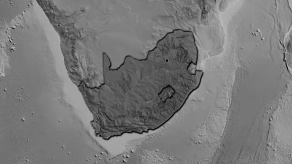 Close-up of the South Africa border area highlighting with a dark overlay on a grayscale map. Capital point. Bevelled edges of the country shape.