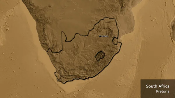 Close-up of the South Africa border area on a sepia elevation map. Capital point. Bevelled edges of the country shape. English name of the country and its capital