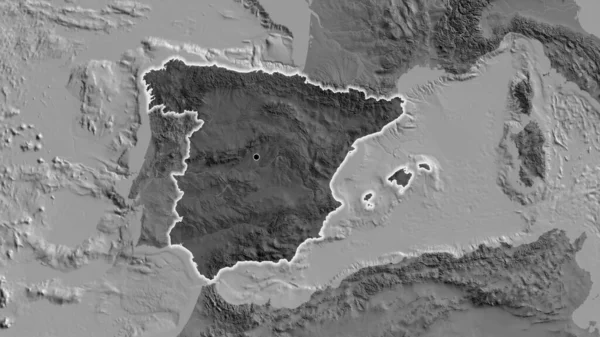 Close-up of the Spain border area highlighting with a dark overlay on a bilevel map. Capital point. Glow around the country shape.