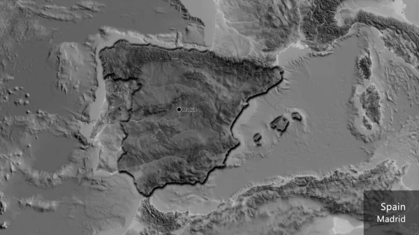 Close-up of the Spain border area highlighting with a dark overlay on a grayscale map. Capital point. Bevelled edges of the country shape. English name of the country and its capital