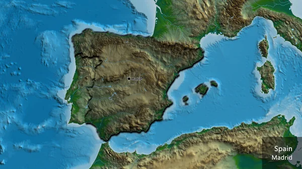 Close-up of the Spain border area highlighting with a dark overlay on a physical map. Capital point. Bevelled edges of the country shape. English name of the country and its capital