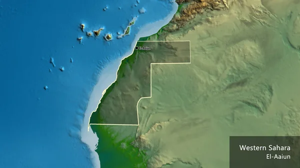 Close-up of the Western Sahara border area highlighting with a dark overlay on a physical map. Capital point. Outline around the country shape. English name of the country and its capital